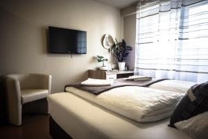 Letto o letti in una camera di Cafe-Restaurant LEO