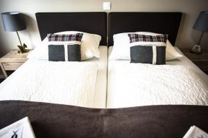 Letto o letti in una camera di Cafe-Restaurant LEO