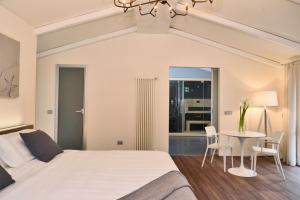 Postel nebo postele na pokoji v ubytování Terra Prime Suite + 37 fotografií
