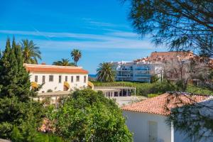a view of the villa from the trees at Villa Eliza in Denia