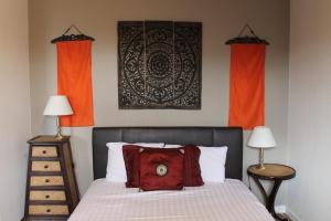 A bed or beds in a room at The Wimbledon Hotel 