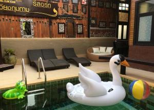 a rendering of a pool with a swan in the water at Wiang Kum Kam Resort in Chiang Mai