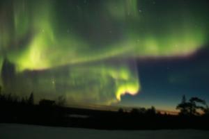 an image of the northern lights in the sky at Rovaniemi City Apartments in Rovaniemi