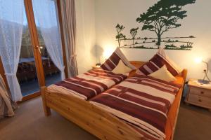 Postel nebo postele na pokoji v ubytování Wolffhotel