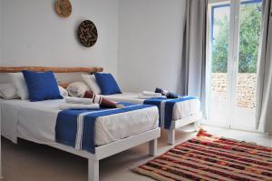 Postel nebo postele na pokoji v ubytování Siamoformentera Valentina