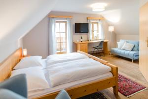 Ένα ή περισσότερα κρεβάτια σε δωμάτιο στο Weingut Schauer