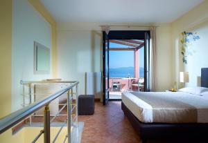 Postel nebo postele na pokoji v ubytování Aeolis Apartments & Studios