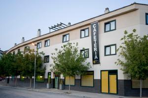 a white building with a sign on the side of it at Hotel Solsona Centre in Solsona