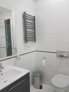 Kúpeľňa v ubytovaní Pokoje Wileńska + 12 fotografií