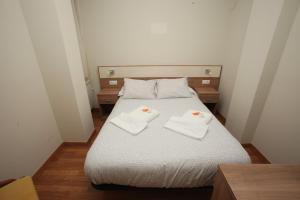 Posteľ alebo postele v izbe v ubytovaní Hostal Restaurante Central