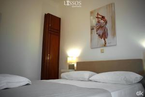 A bed or beds in a room at Chania Lissosaparments
