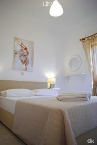 A bed or beds in a room at Chania Lissosaparments