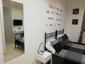 A bed or beds in a room at ImeraRooms