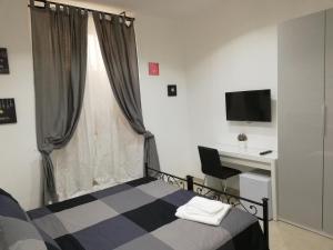 A television and/or entertainment centre at ImeraRooms