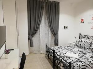 A bed or beds in a room at ImeraRooms