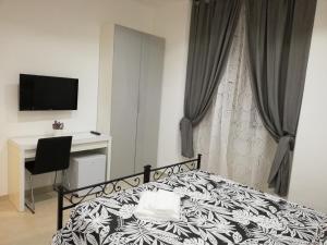 A bed or beds in a room at ImeraRooms