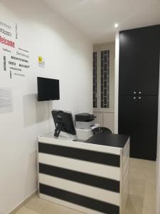 A television and/or entertainment centre at ImeraRooms