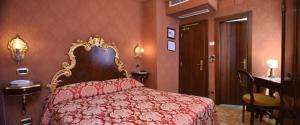 Postel nebo postele na pokoji v ubytování Hotel Ateneo
