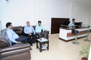 a group of people sitting on a couch in a room at Hotel Sri Krishna Residency in Udupi