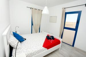 En eller flere senge i et værelse på Aguamarina by Sea You There Fuerteventura