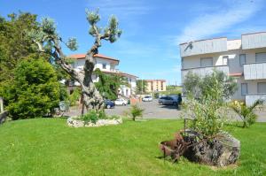 Κήπος έξω από το Hotel Toscano