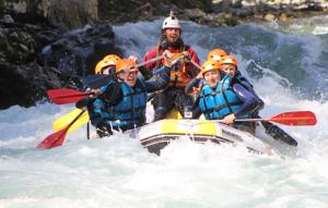 a group of people in a raft on a river at Hotel Azabache Susierra in Cangas de Onís
