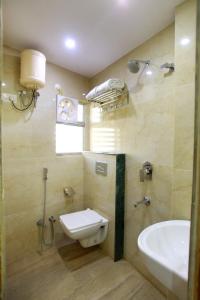 a bathroom with a toilet and a sink at Hotel City Palace in Jodhpur