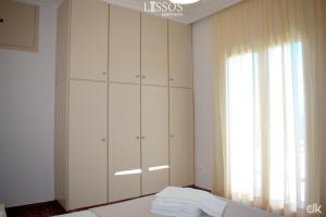A bed or beds in a room at Chania Lissosaparments