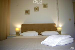 A bed or beds in a room at Chania Lissosaparments