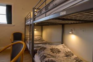 Tempat tidur dalam kamar di Hotel Hjardarbol