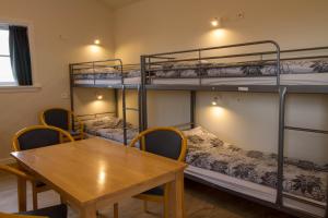 Tempat tidur dalam kamar di Hotel Hjardarbol