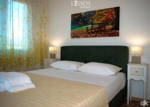 A bed or beds in a room at Chania Lissosaparments