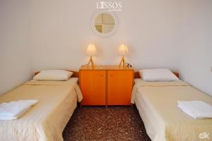 A bed or beds in a room at Chania Lissosaparments
