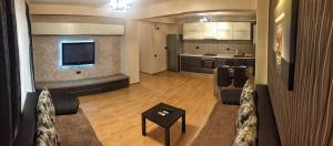 A cozinha ou cozinha compacta de C&Y Apartments Metropol