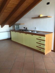 a kitchen with a sink and a counter top at Casa regina in Desenzano del Garda