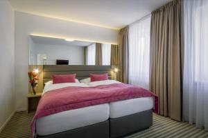 Krevet ili kreveti u jedinici u okviru objekta Hotel White Lion