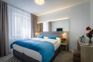 Krevet ili kreveti u jedinici u okviru objekta Hotel White Lion