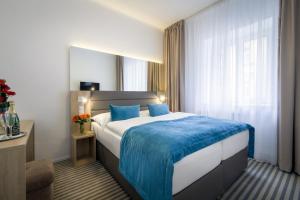Krevet ili kreveti u jedinici u okviru objekta Hotel White Lion