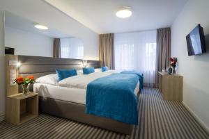 Krevet ili kreveti u jedinici u okviru objekta Hotel White Lion