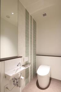 Koupelna v ubytování New Matto Terminal Hotel