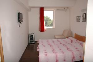 Postel nebo postele na pokoji v ubytování Villa Sparadise
