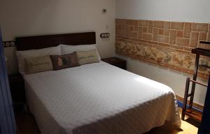 Postel nebo postele na pokoji v ubytování Casa Rural La Tia Lola