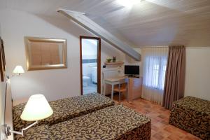 TV a/nebo společenská místnost v ubytování Hotel Monte Cimone
