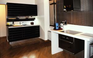 a kitchen with a sink and a counter top at BeMyGuest Rutigliano in Rutigliano