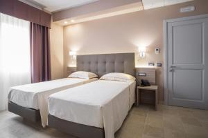 Krevet ili kreveti u jedinici u okviru objekta Netum Hotel