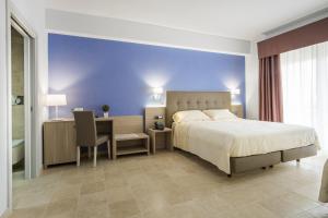 Krevet ili kreveti u jedinici u okviru objekta Netum Hotel