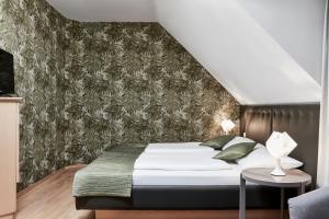 Postel nebo postele na pokoji v ubytování Hotel Birkenhof