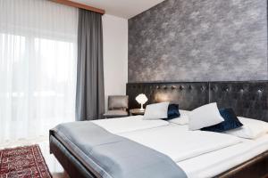 Postel nebo postele na pokoji v ubytování Hotel Birkenhof