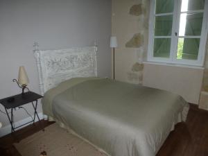 Кровать или кровати в номере DOMAINE D'ENTUDELLE