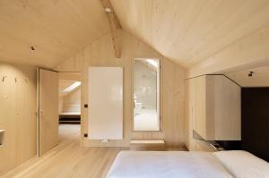 A bed or beds in a room at Försterhaus Mellau